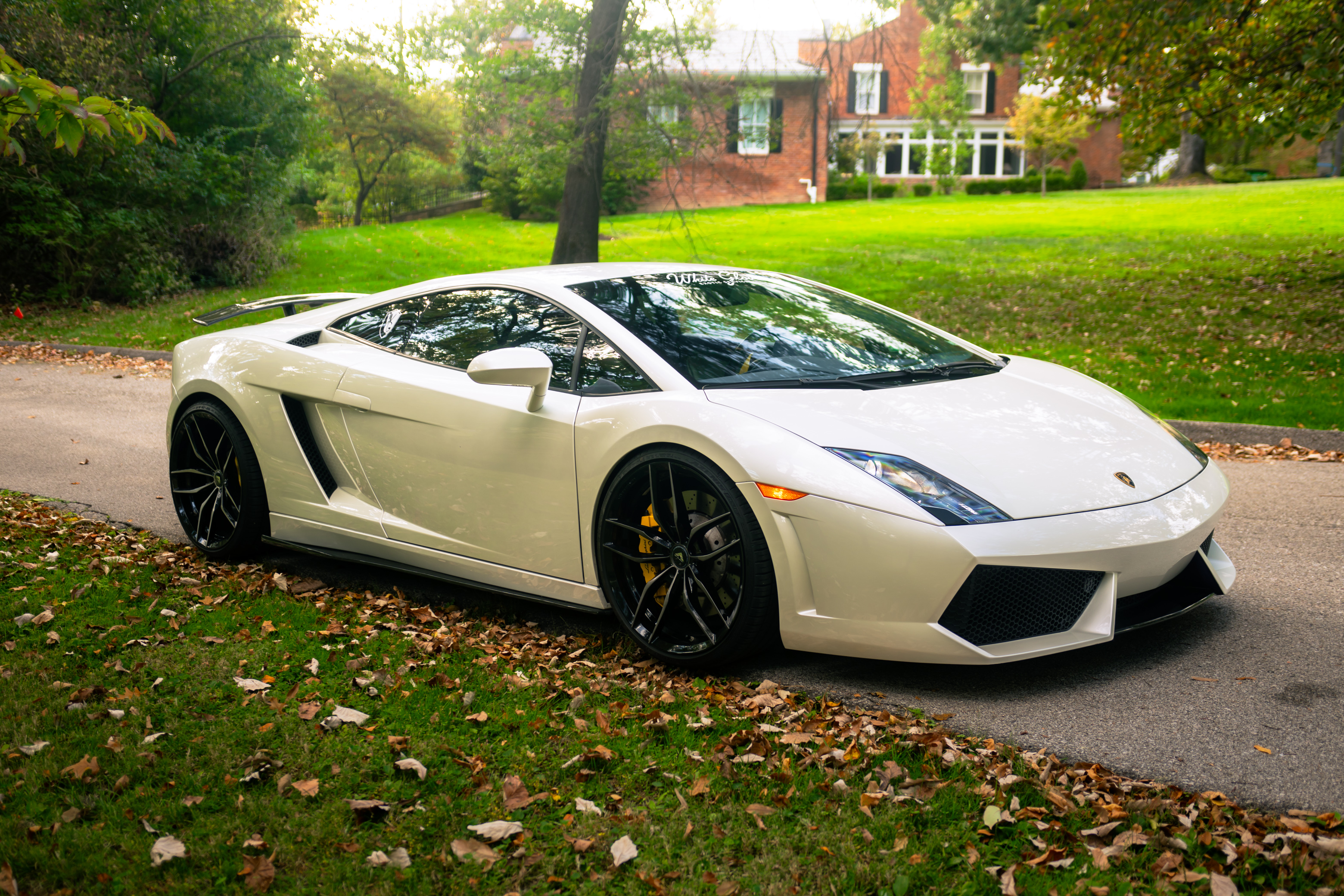 WHITE SHELL. SCISSOR DOORS. NOTHING STANDARD.